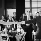 Bride and groom share a joyful first dance at elegant Boston wedding reception.