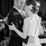 Bride and groom share a romantic first dance at their Boston wedding in black and white.