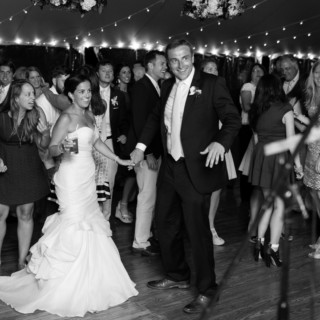 Bride and groom dancing joyfully at Newagen Seaside Inn wedding in Southport, Maine.