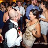 Joyful guests dancing and laughing at a lively Spring House Hotel wedding reception on Block Island.