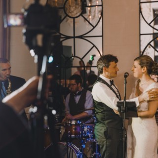 Bride and groom share emotional moment with live band at Alden Castle wedding in Brookline.