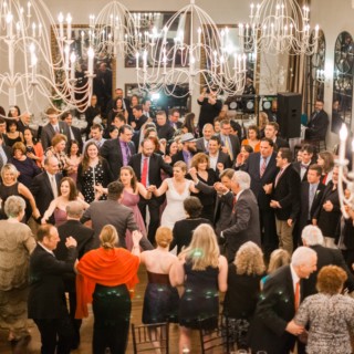 Bride dancing surrounded by guests at elegant Alden Castle wedding in Brookline, Massachusetts.