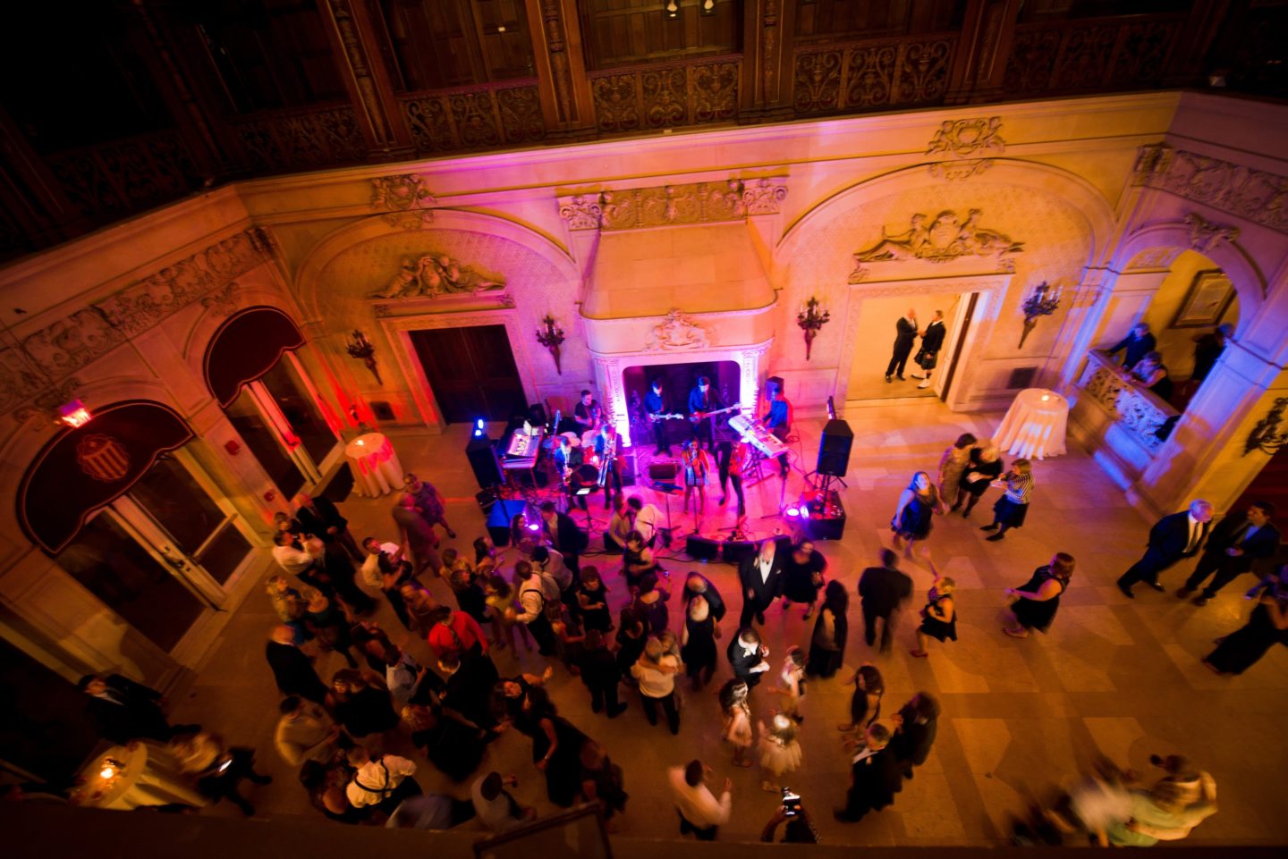 Elegant wedding reception with live band and dancing guests in the grand ballroom of Ochre Court.