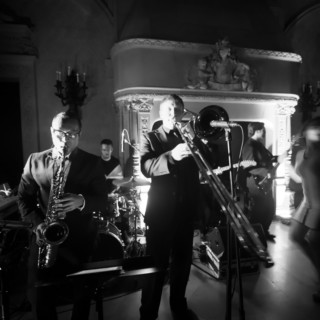 Black and white jazz band performing live at an elegant Newport wedding reception.