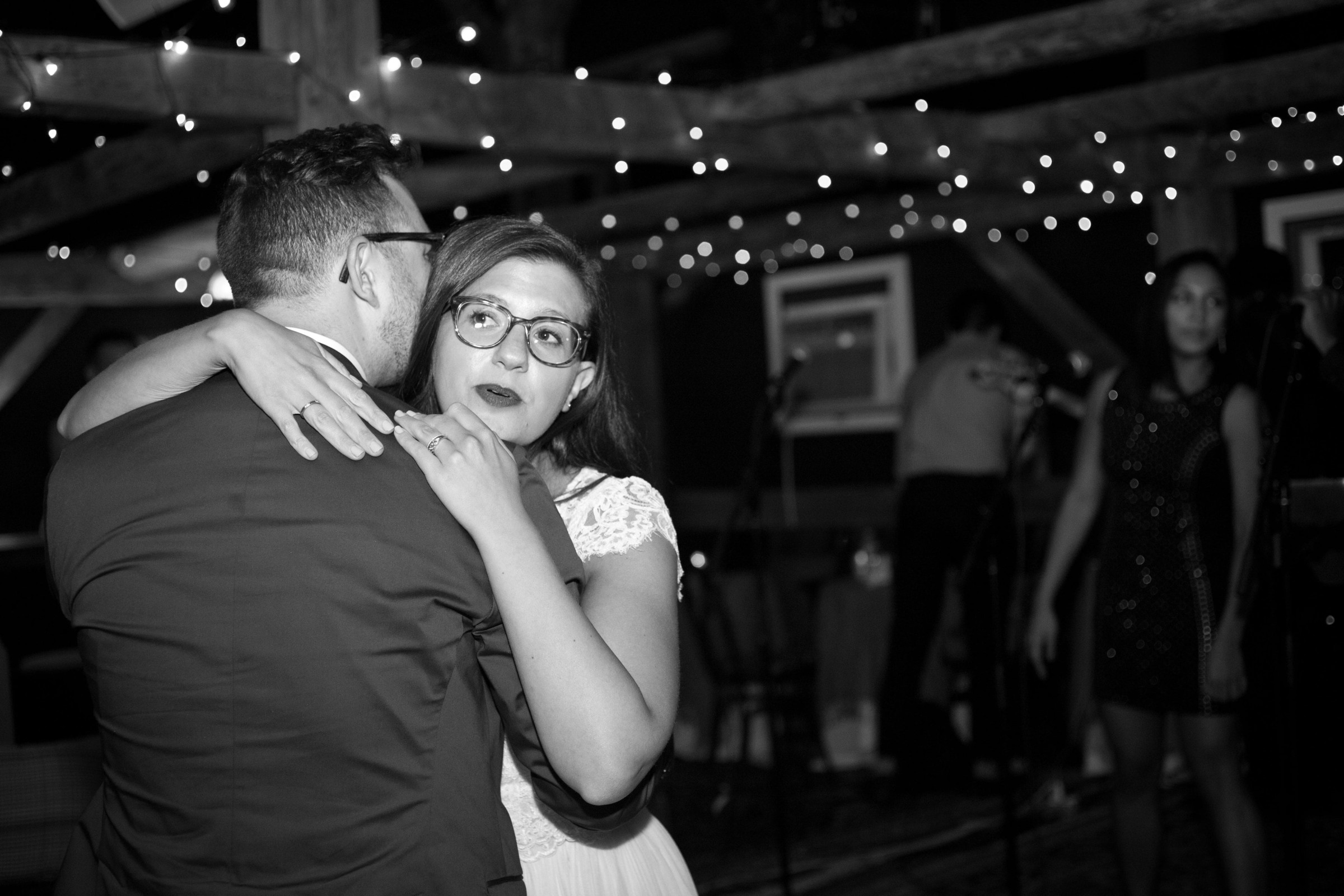 Bride and groom share an emotional embrace at Stone Mountain Arts Center wedding in Maine.