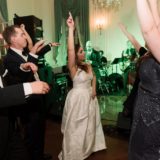 Bride dancing with guests at lively Glen Manor House wedding reception in Portsmouth, Rhode Island.