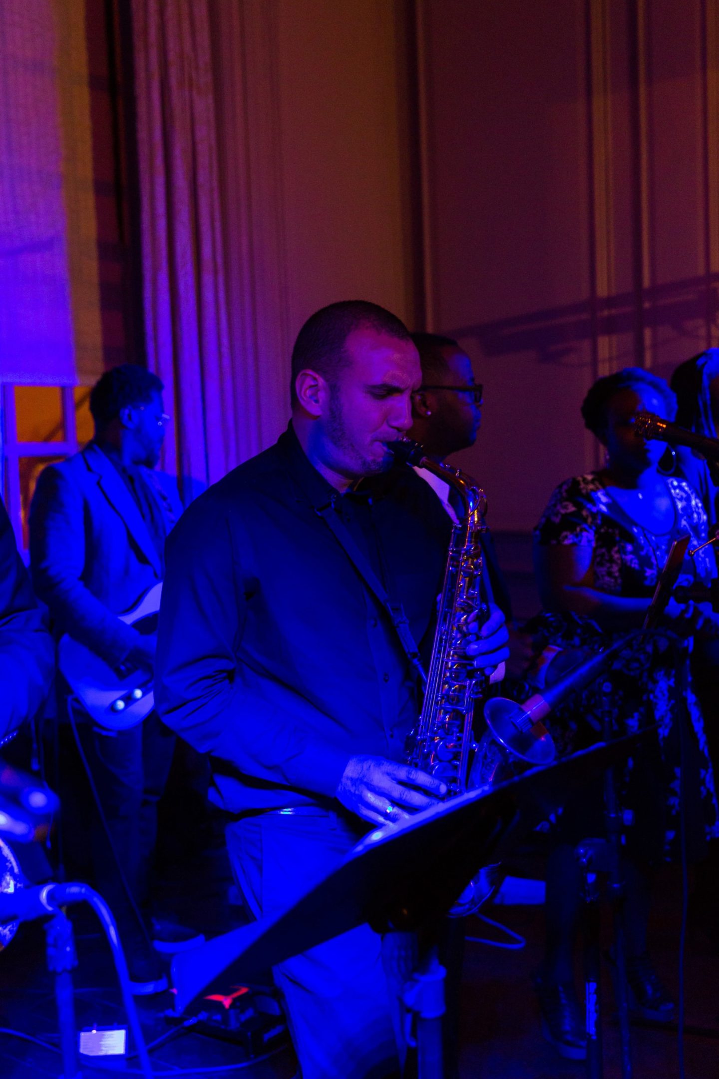 Two brides share a romantic first dance at their elegant Crane Estate wedding in Ipswich, Massachusetts.