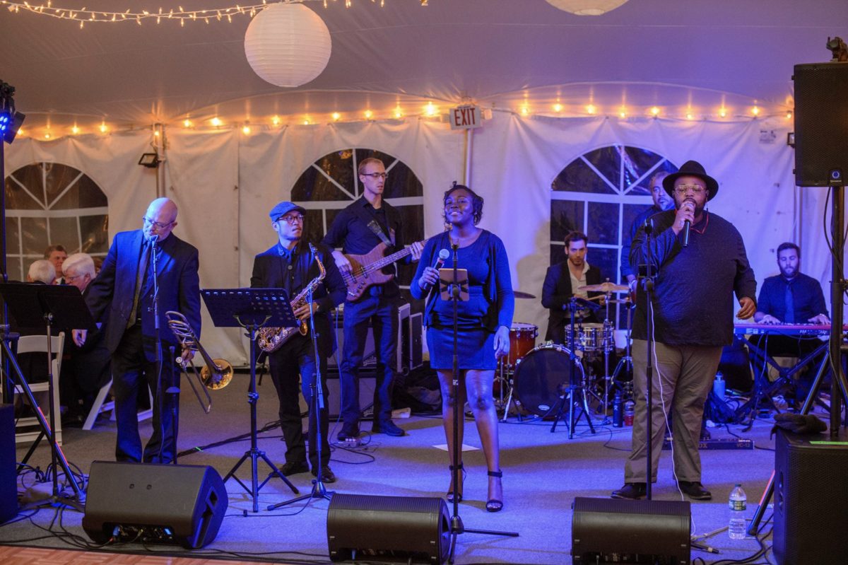 Live jazz and soul band performing under warm lights at a Waterville Valley wedding reception.
