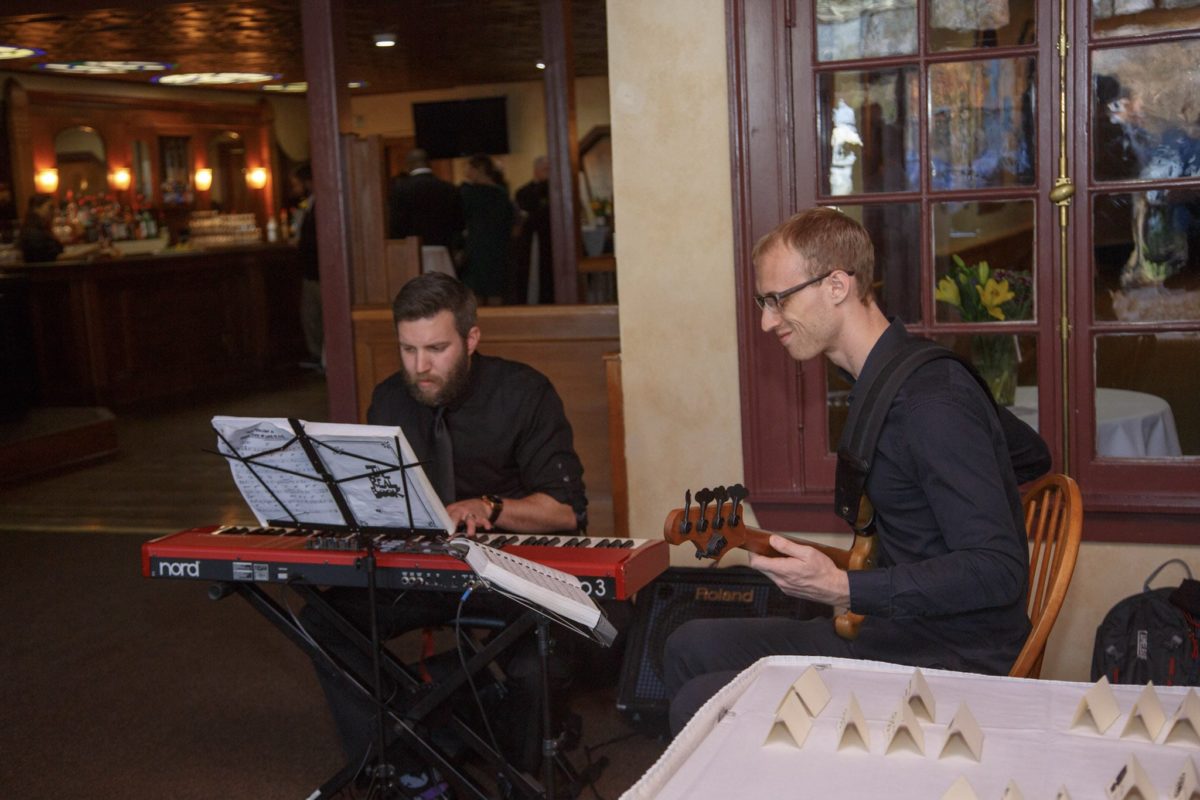 Jazz duo performing live at an elegant indoor wedding reception in Waterville Valley, New Hampshire.