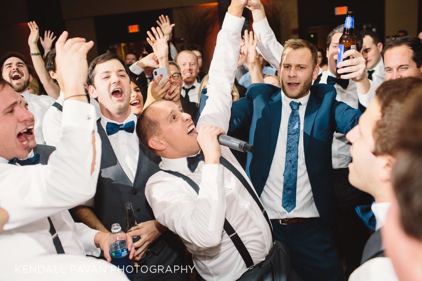 Bride and groom share first dance surrounded by guests at Boston Harbor wedding reception.