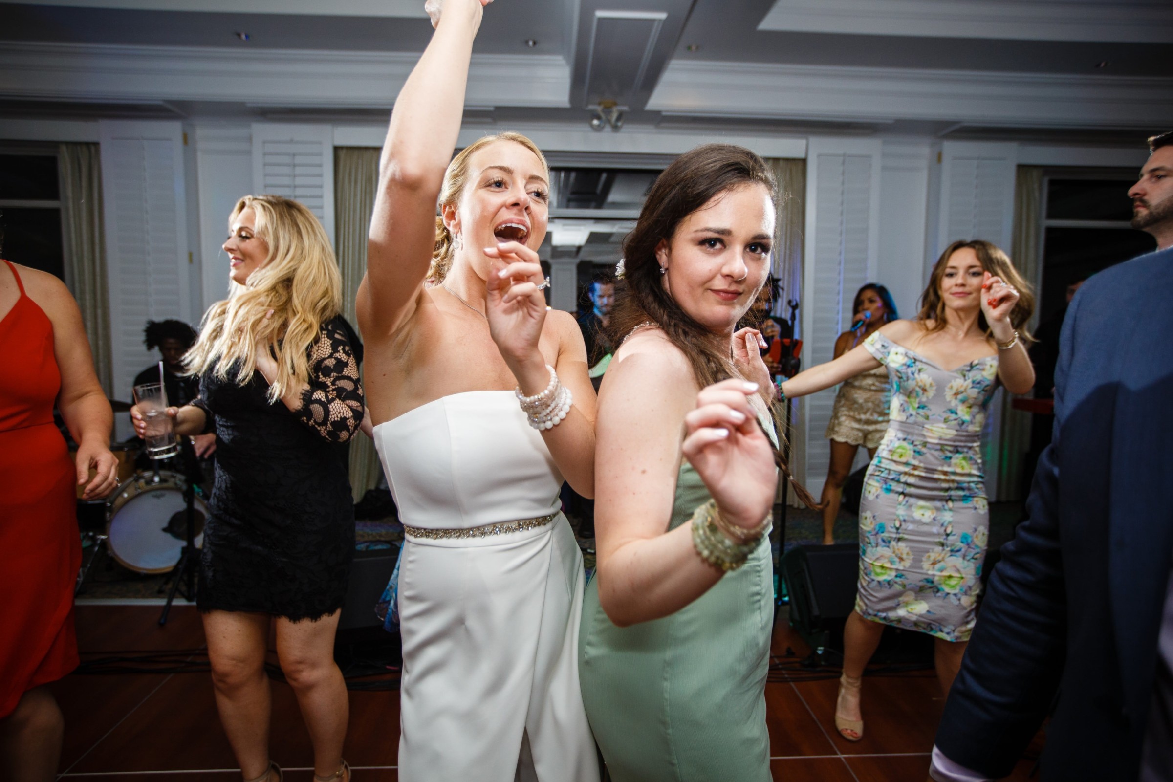 Bride and guests dancing joyfully at Willowbend Country Club wedding reception in Mashpee, Massachusetts.