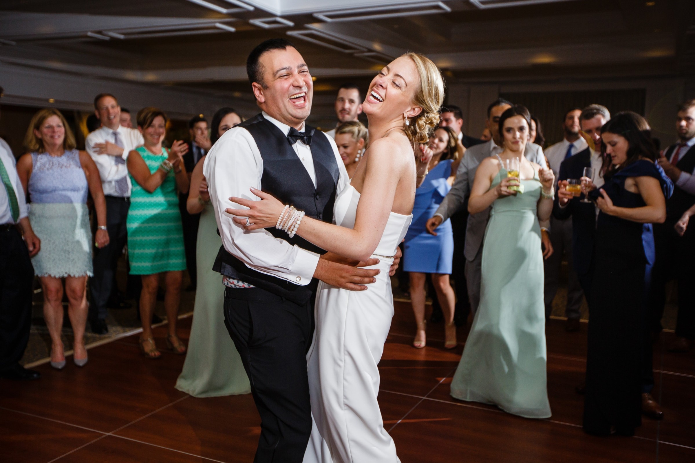 Bride and groom laughing during first dance at Willowbend Country Club wedding in Mashpee.