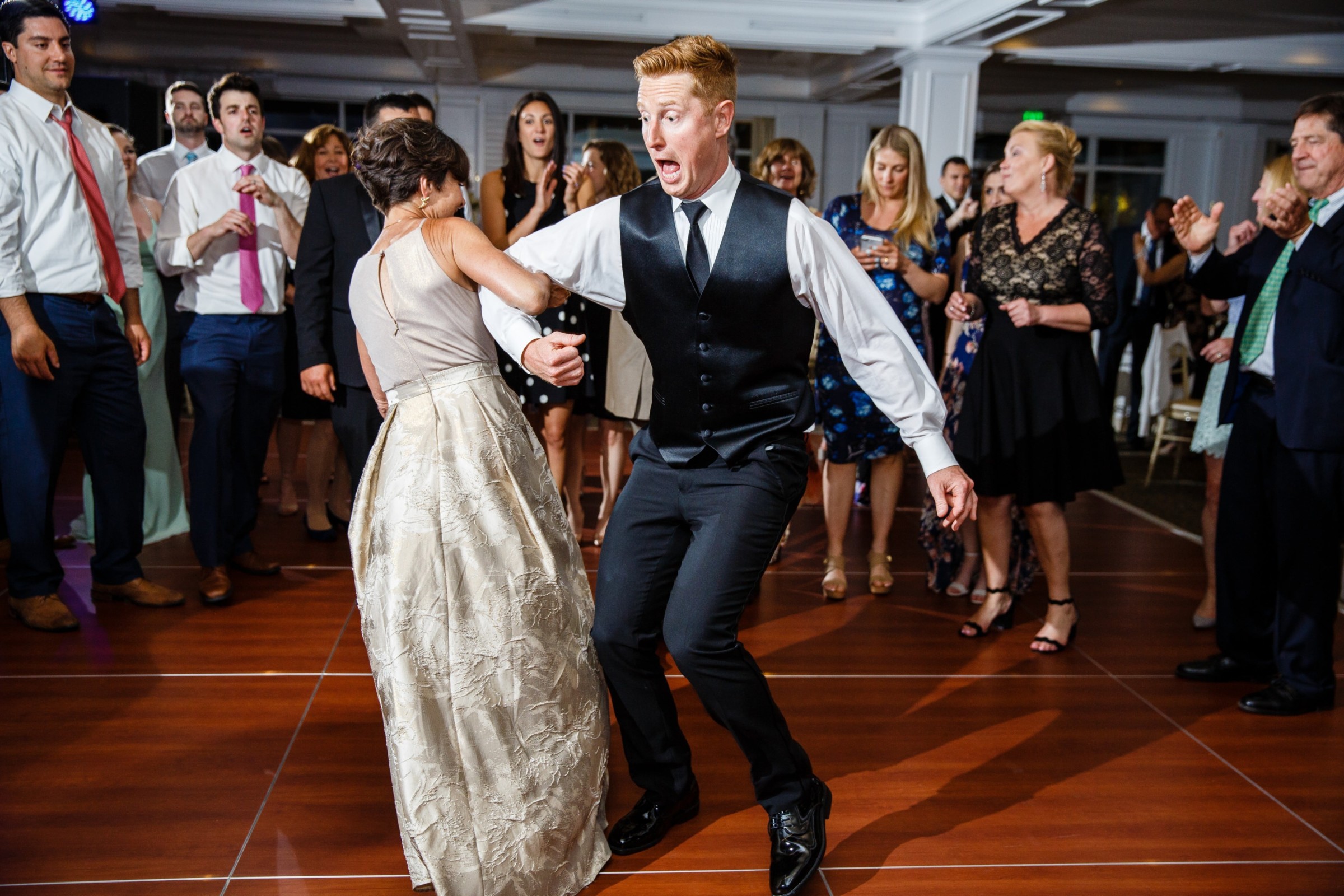 Joyful couple dancing at Willowbend Country Club wedding in Mashpee, Massachusetts.