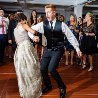 Joyful couple dancing at Willowbend Country Club wedding in Mashpee, Massachusetts.