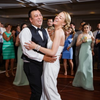 Bride and groom laughing during first dance at Willowbend Country Club wedding in Mashpee.