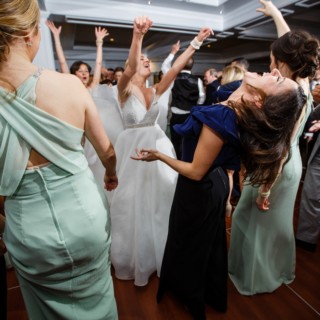 Bride and guests dancing joyfully at lively Willowbend Country Club wedding in Mashpee, Massachusetts.