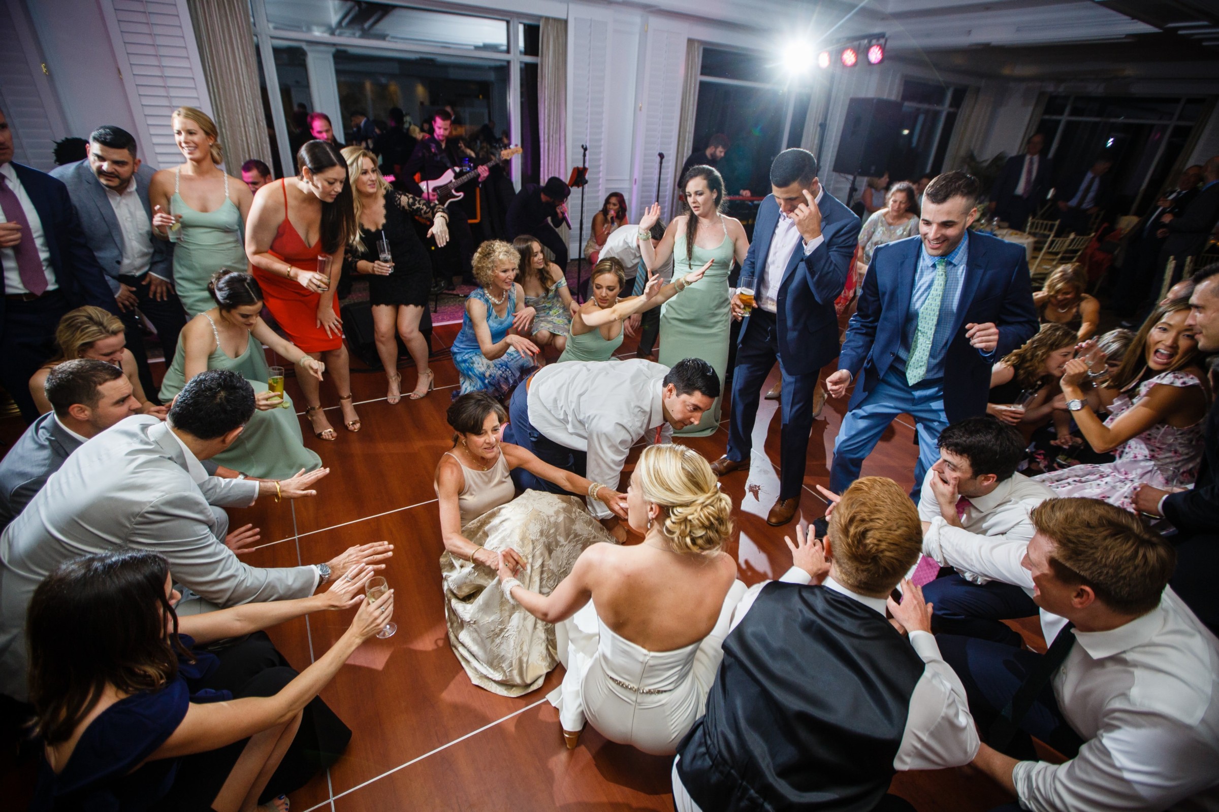 Bride dancing with guests at lively Willowbend Country Club wedding in Mashpee, Massachusetts.