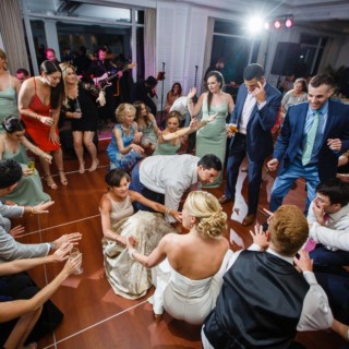 Bride dancing with guests at lively Willowbend Country Club wedding in Mashpee, Massachusetts.