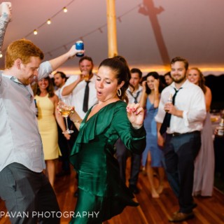 Joyful couple dancing at Fort Adams wedding reception in Newport, Rhode Island.