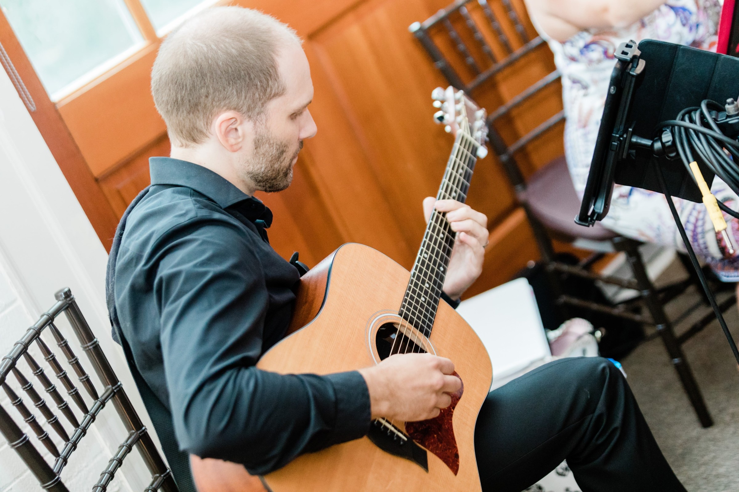 Acoustic guitarist performing indoors at Elm Bank wedding in Wellesley, Massachusetts.