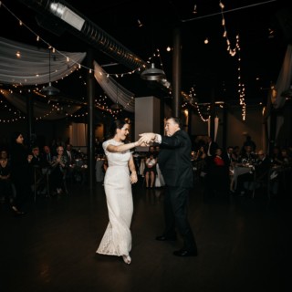 Bride and groom share first dance at Rivermill wedding in Dover, New Hampshire.