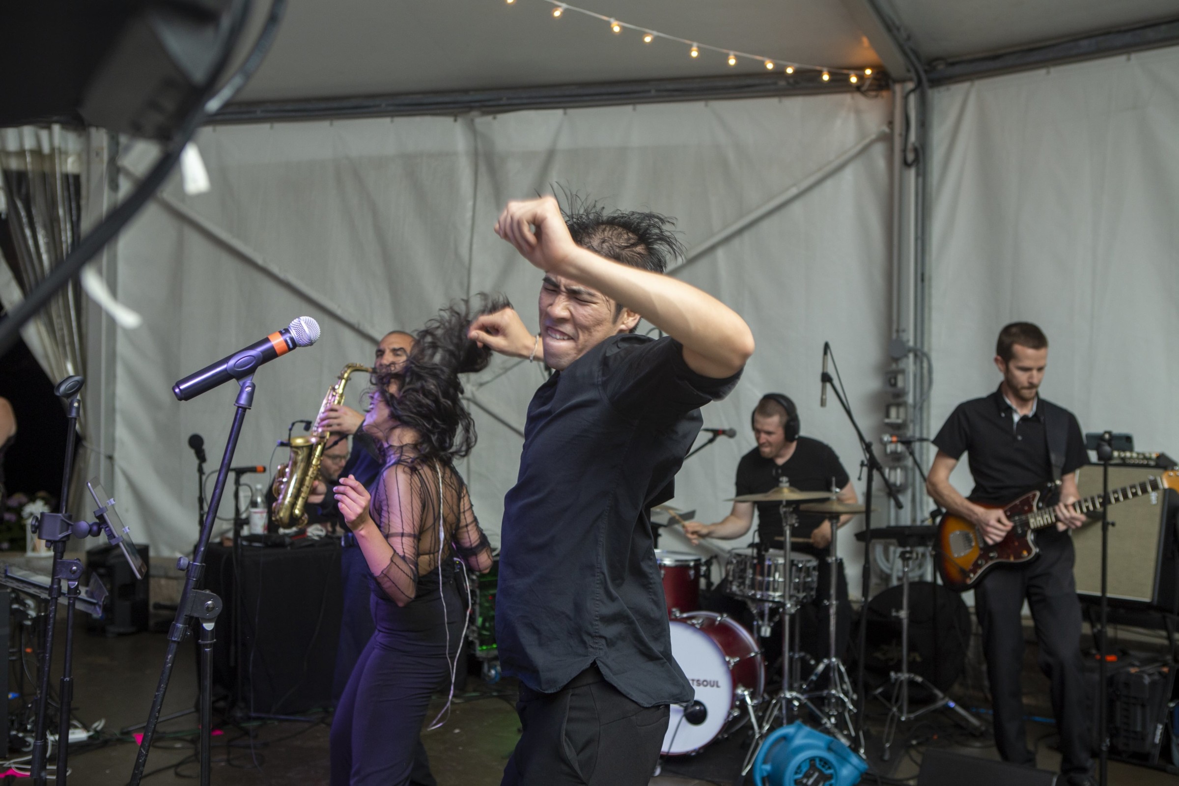 Energetic live band performance under canopy lights at Granite Links Golf Club in Quincy, MA.