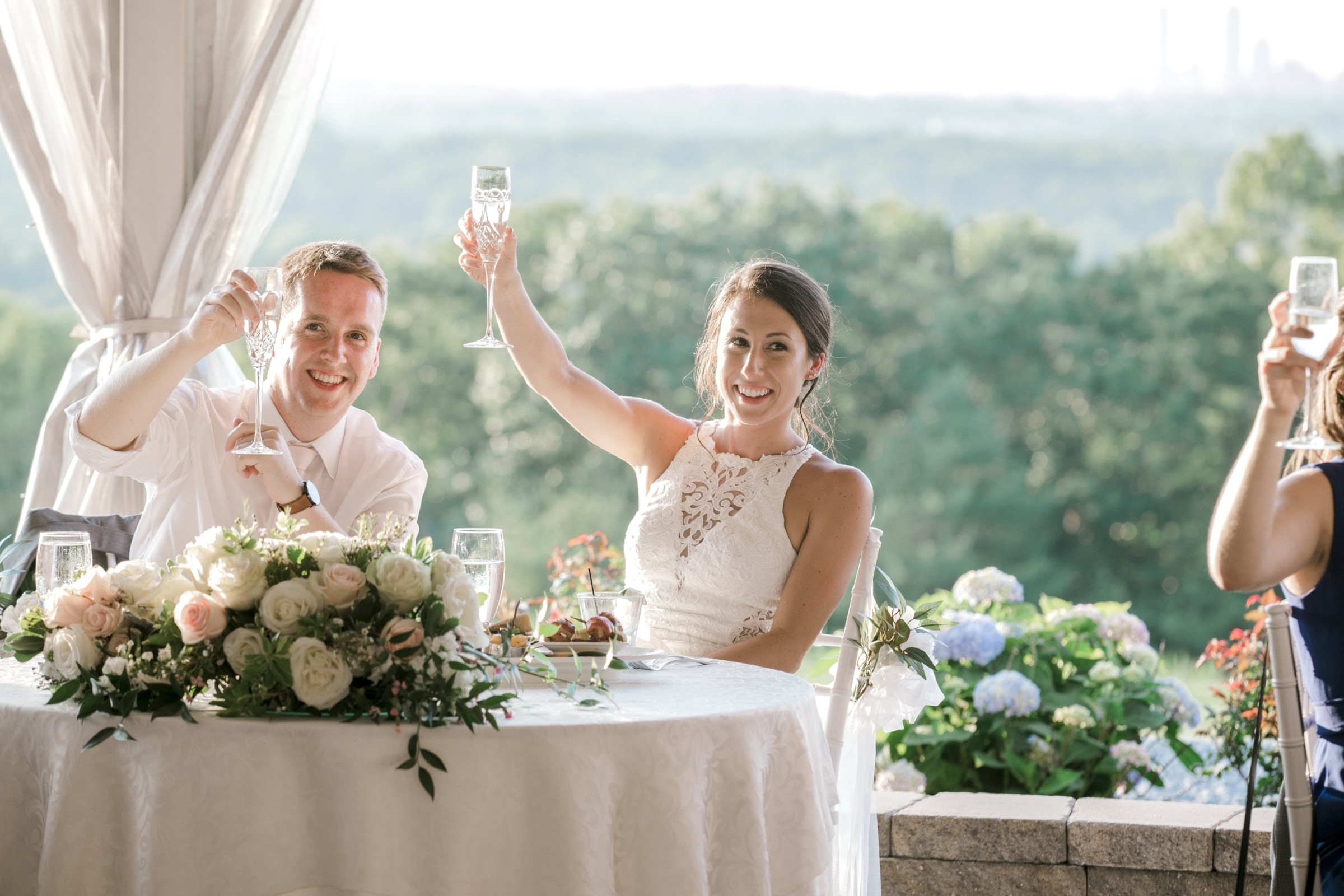 Bride and groom toasting at Granite Links wedding reception in Quincy, Massachusetts.