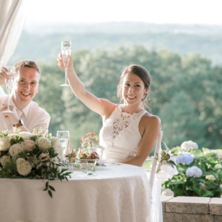 Bride and groom toasting at Granite Links wedding reception in Quincy, Massachusetts.