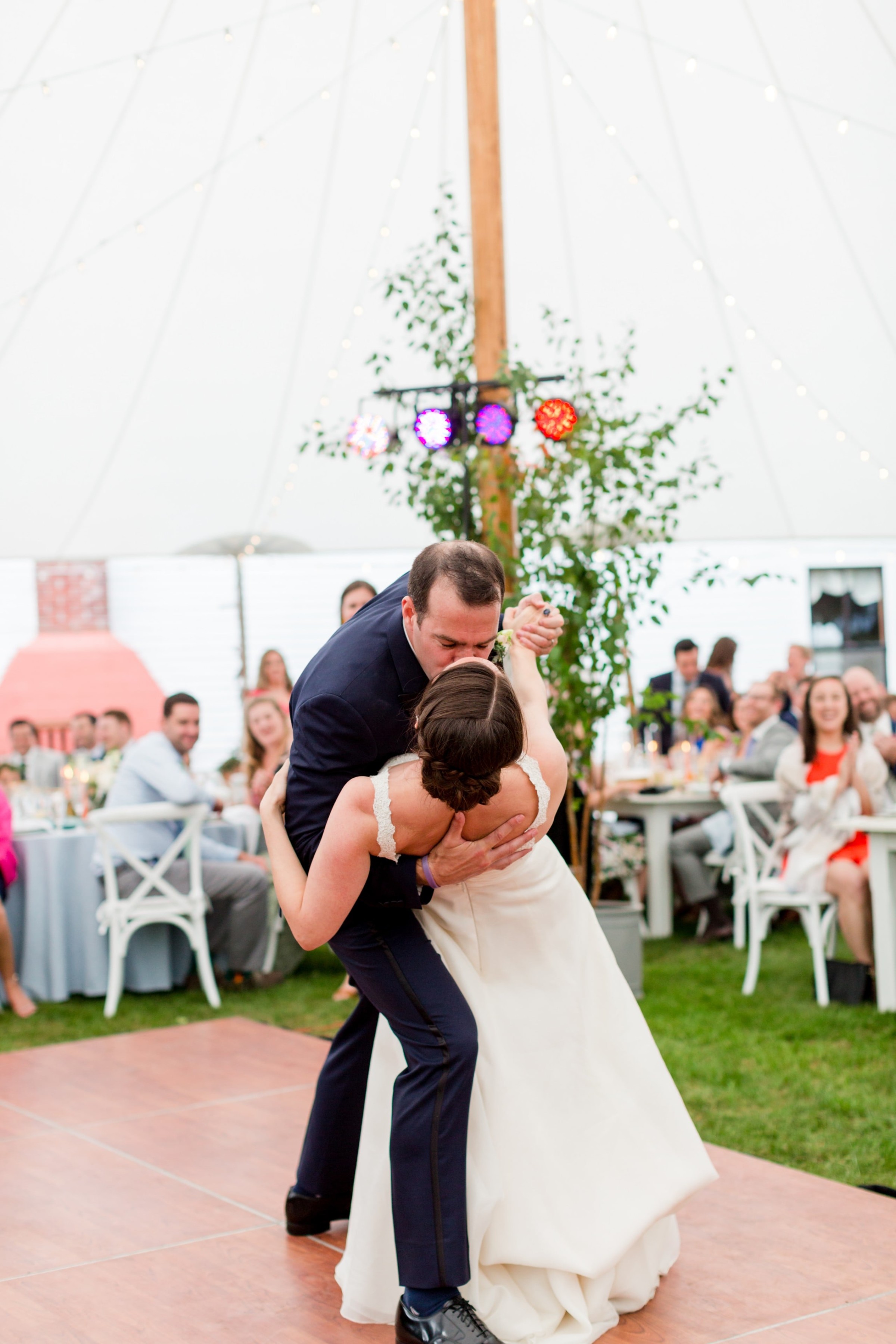 Bride and groom share a romantic first dance kiss at Twin Lakes Village wedding in New London.