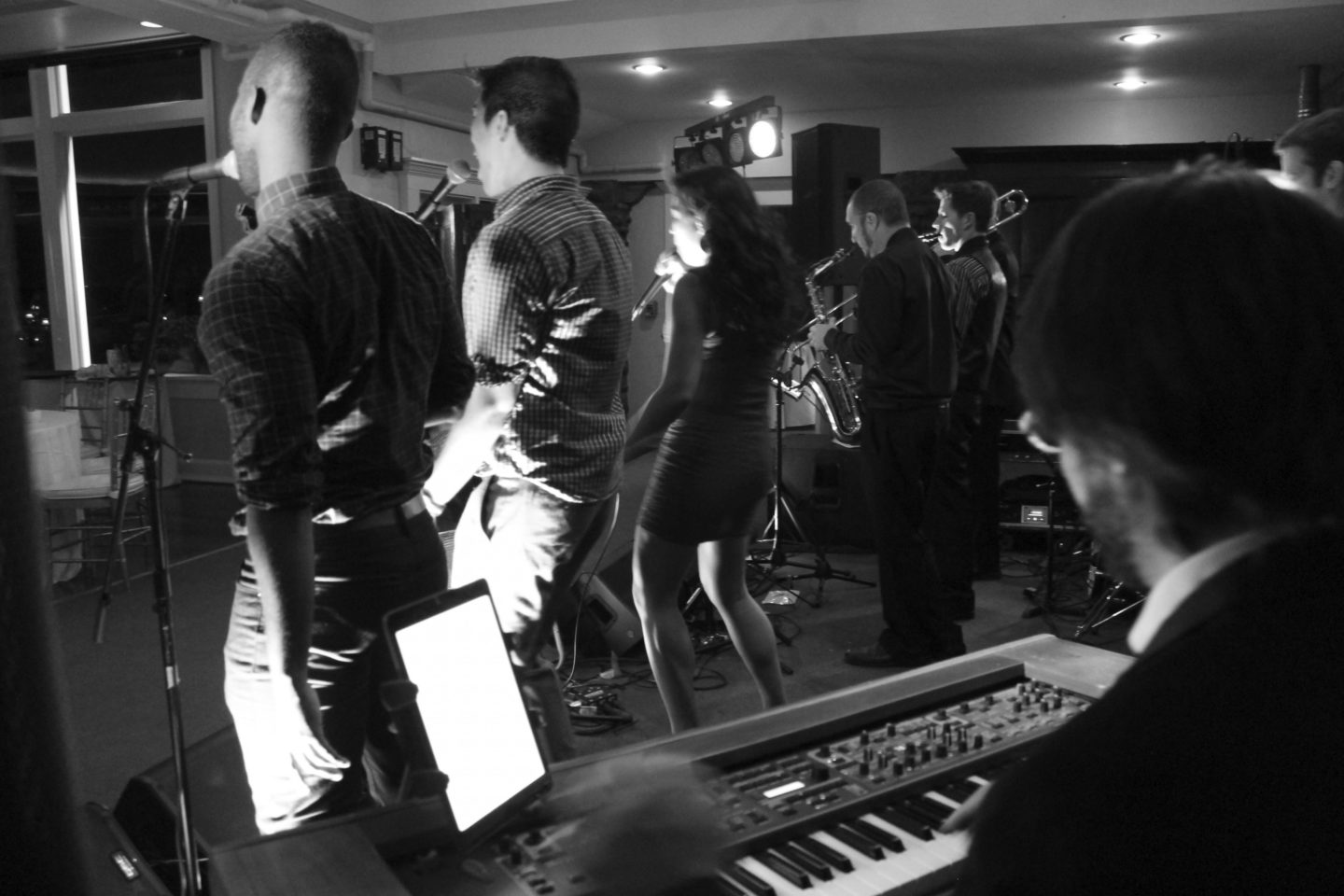 Black and white wedding band performing live at OceanCliff Newport with passionate singers and musicians.