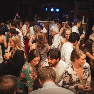 Guests dancing and celebrating at an elegant wedding reception in Pomfret, Vermont.