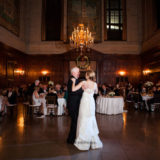 Father and bride share emotional first dance in elegant wood-paneled Harvard Club Boston ballroom.