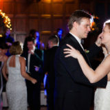 Bride and groom share a romantic first dance at elegant holiday wedding in Boston.
