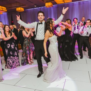 Bride and groom dancing joyfully at elegant InterContinental Boston wedding reception.