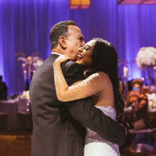 Bride shares joyful father-daughter dance at elegant Boston wedding reception.