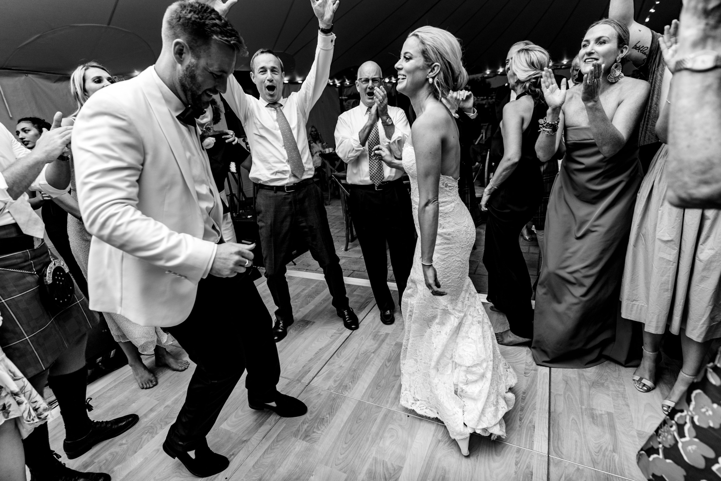 Bride and groom dancing joyfully at Wentworth by the Sea wedding in Rye, New Hampshire.