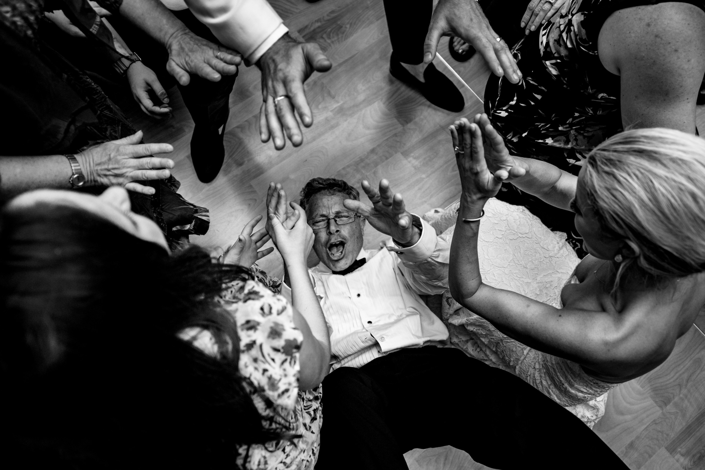 Joyful black-and-white wedding dance floor celebration at Wentworth by the Sea in Rye, New Hampshire.