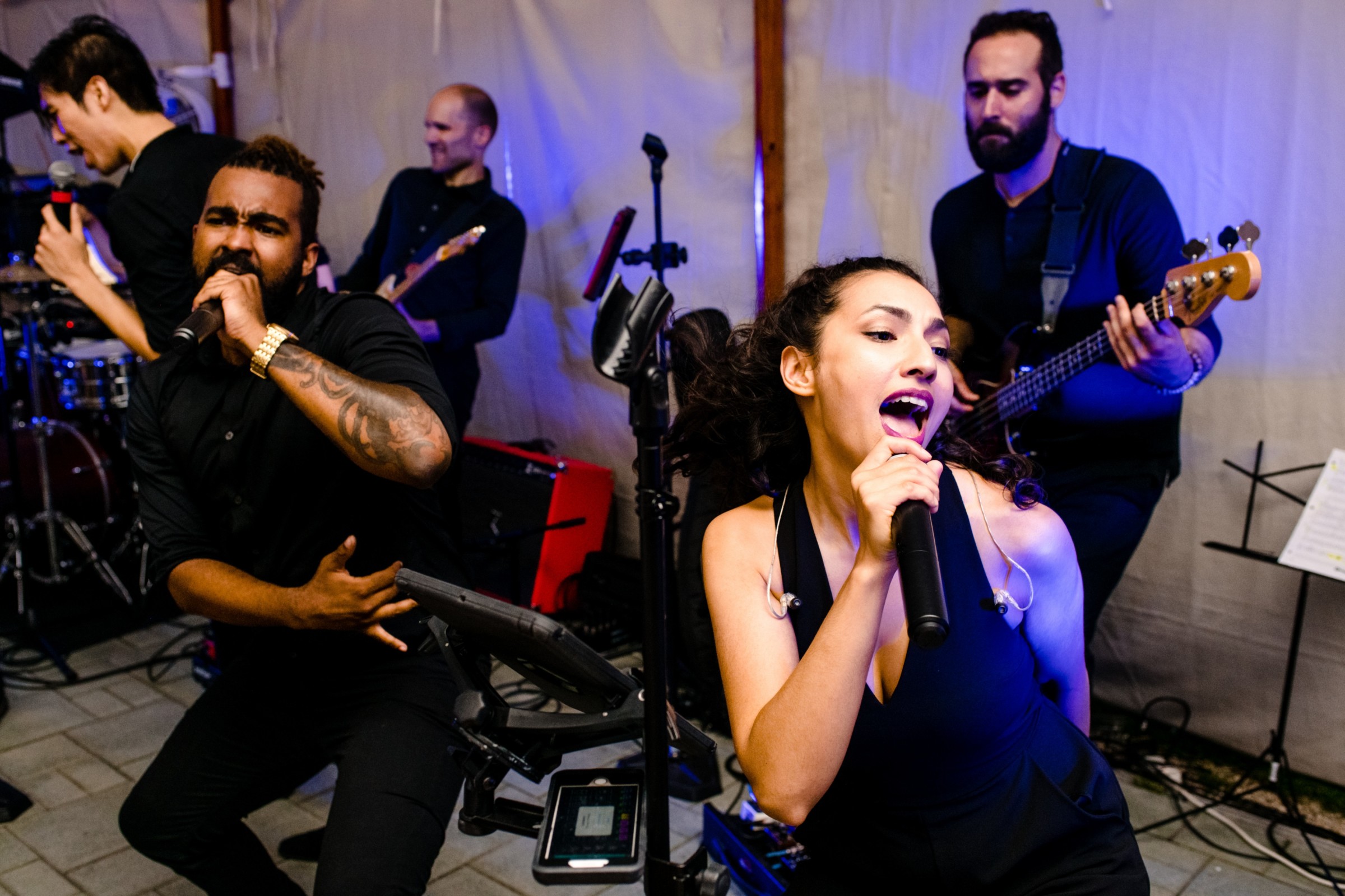 Energetic live band performing with two passionate singers at a vibrant Wentworth by the Sea wedding.