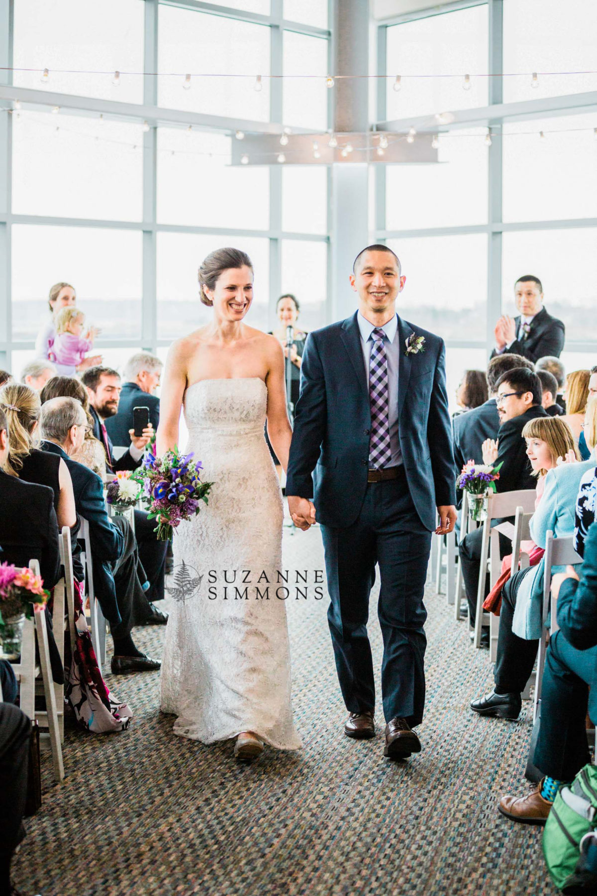 Bride and groom walking down the aisle at Ocean Gateway wedding in Portland, Maine.