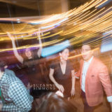 Guests dancing under golden lights at a lively Ocean Gateway wedding in Portland, Maine.