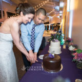 Bride and groom cutting wedding cake at Ocean Gateway in Portland, Maine.