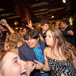 Dartmouth students dancing and celebrating together at a lively indoor college party.