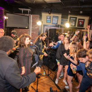 Live band performing at Salt Hill Pub in Lebanon NH with energetic crowd and warm ambiance.