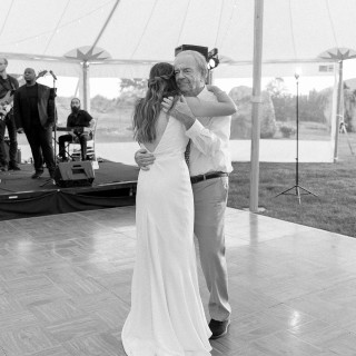 Bride and father share emotional dance under tent at elegant Maine wedding reception.
