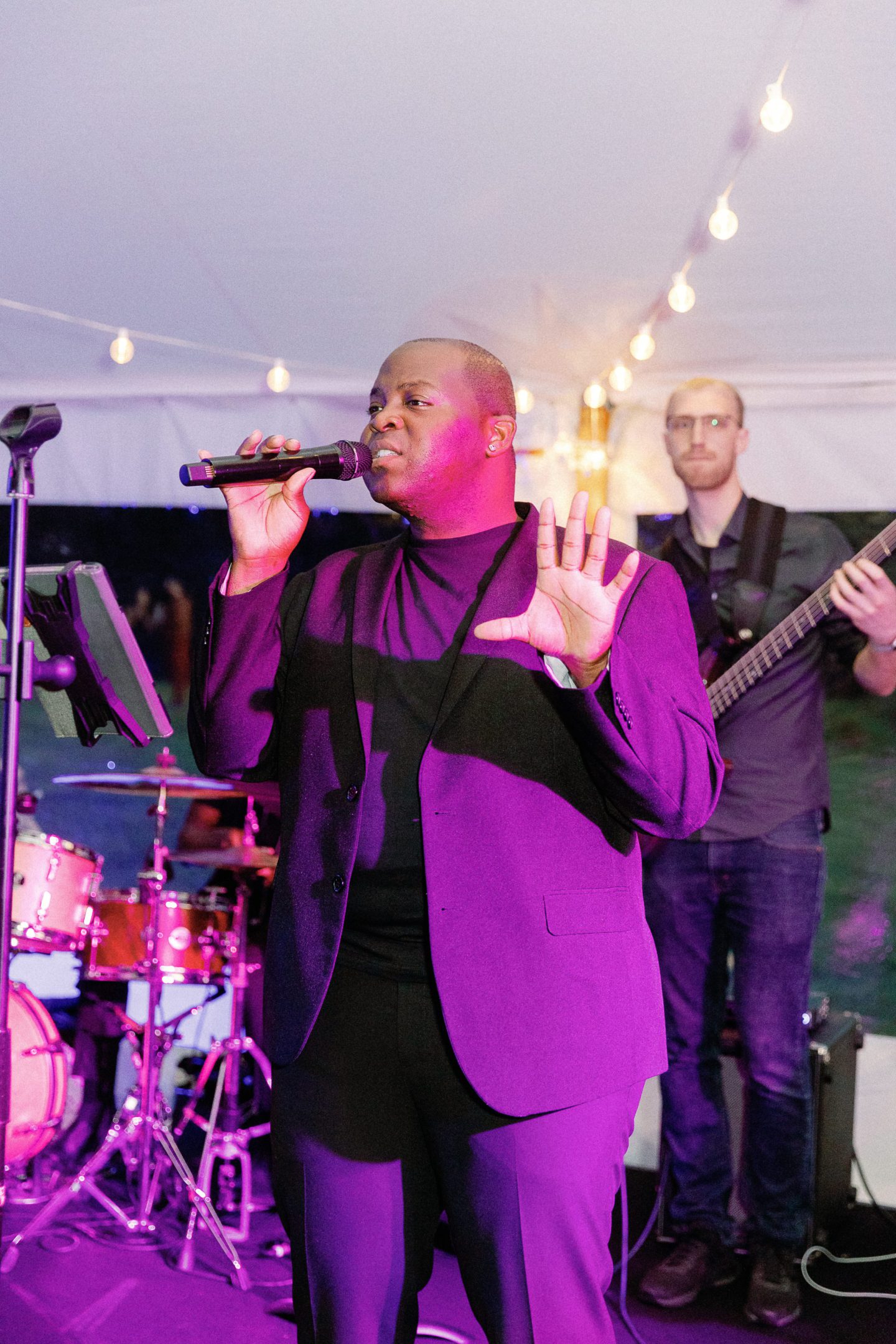 Elegant outdoor wedding reception under a white tent at sunset in Biddeford Pool, Maine.