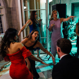 Guests dancing joyfully at a vibrant Aldrich Mansion wedding reception in Warwick, Rhode Island.