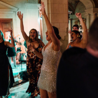 Guests dancing joyfully at Aldrich Mansion wedding reception in Warwick, Rhode Island.