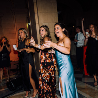 Guests reacting with excitement during an elegant Aldrich Mansion wedding reception in Warwick, Rhode Island.