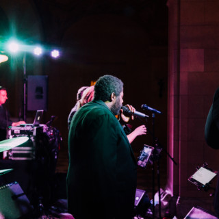 Live band performing at Aldrich Mansion wedding with colorful lighting in Warwick, Rhode Island.