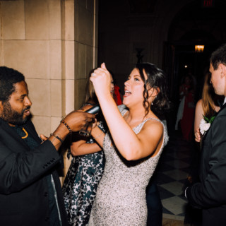 Woman singing joyfully at elegant Aldrich Mansion wedding reception in Warwick, Rhode Island.